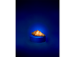 A golden croissant on a blue pedestal against a dark blue background.