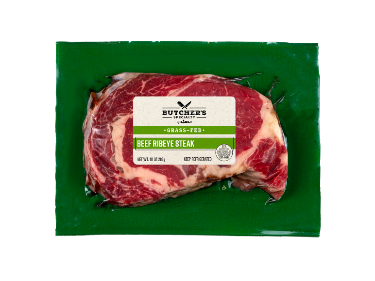 Vacuum-packed beef ribeye steak, with a grass-fed meat label.
