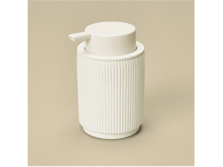 White soap dispenser with a ribbed texture.