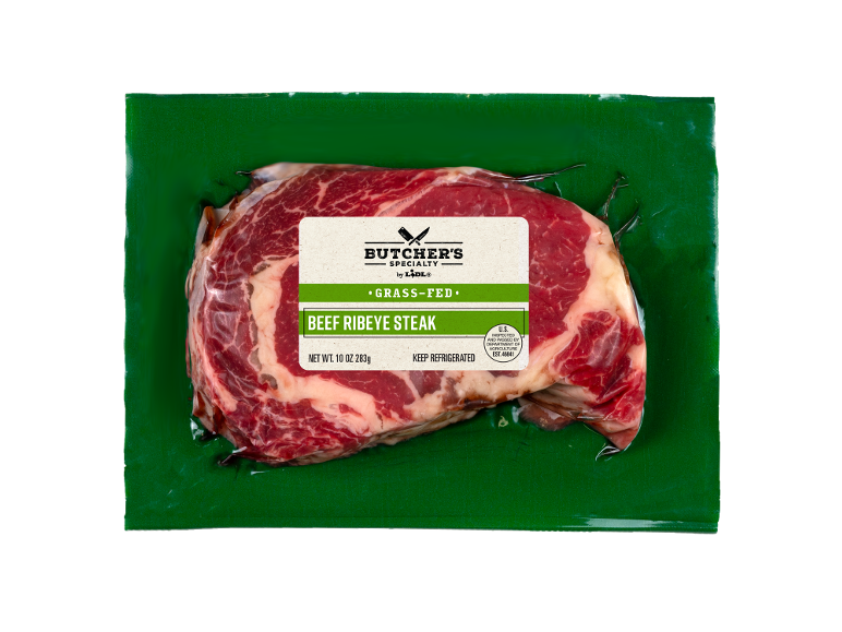 Vacuum-packed beef ribeye steak, with a grass-fed meat label.