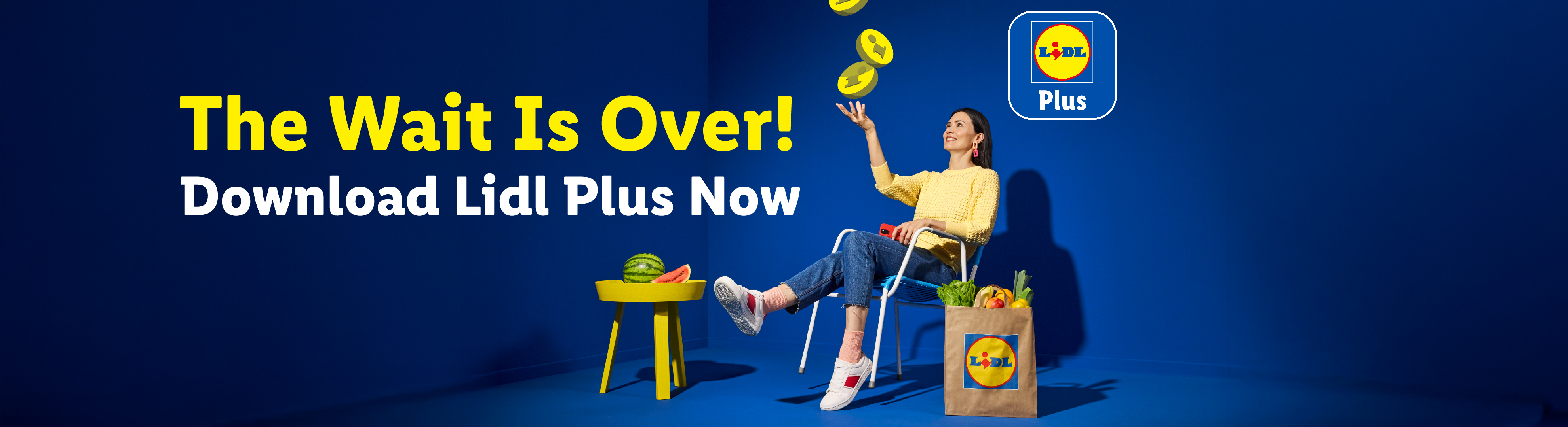 Woman catching coins, with text 'The Wait Is Over! Download Lidl Plus Now' and a shopping bag.