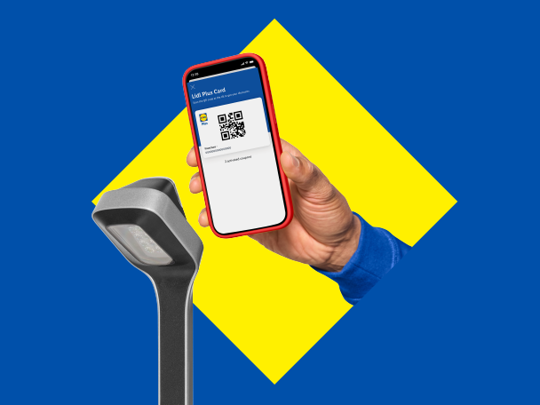 Hand holding a smartphone displaying a loyalty card QR code, near a scanner.