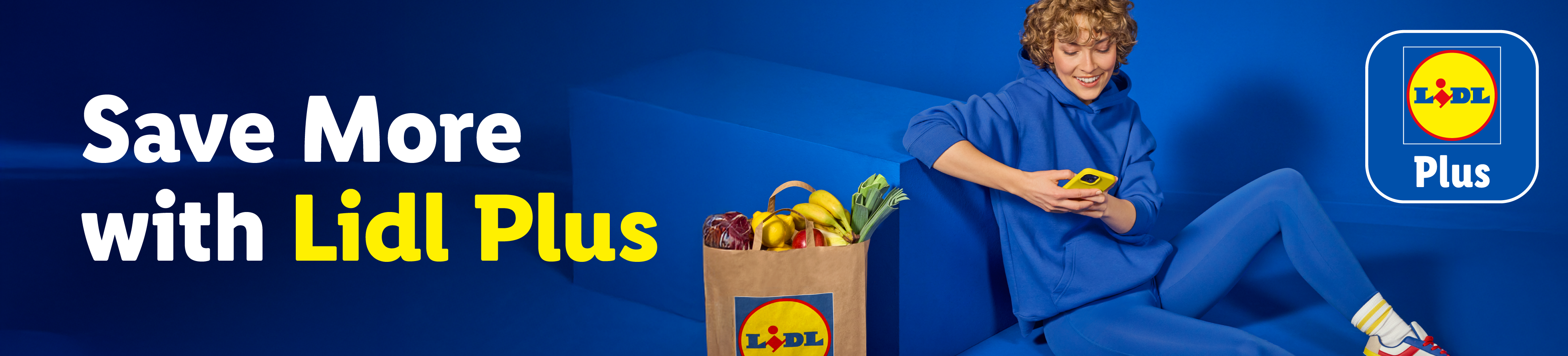 A person using a phone next to a grocery bag, with the text Save More with Lidl Plus.